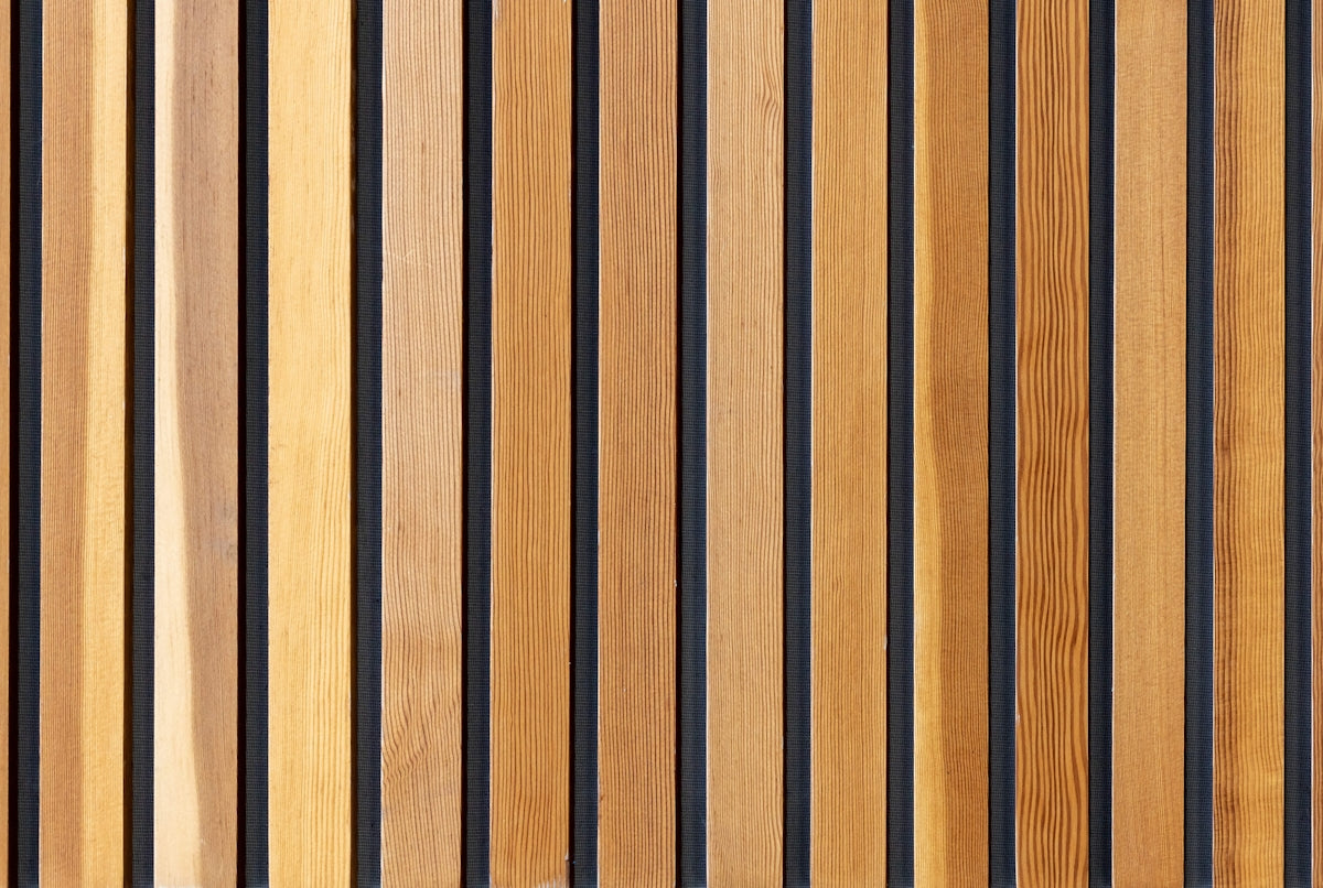 two brown wooden wall decors