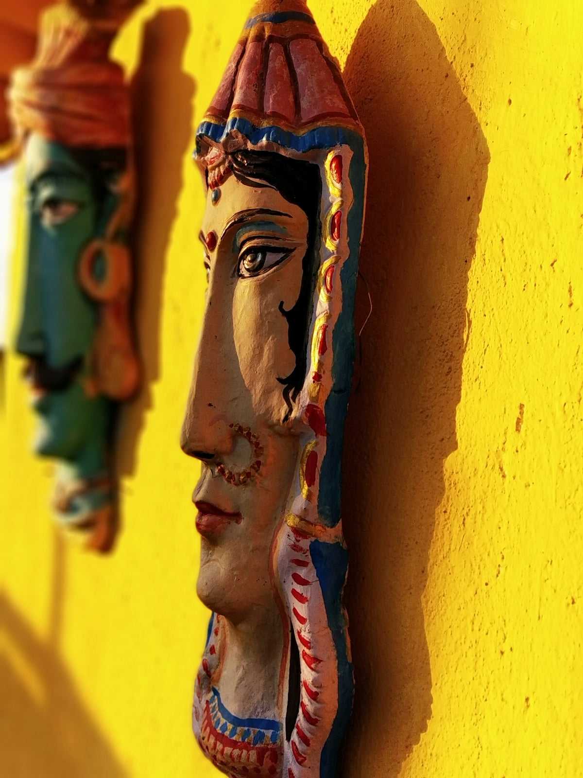 woman face themed wall decors on focus photography