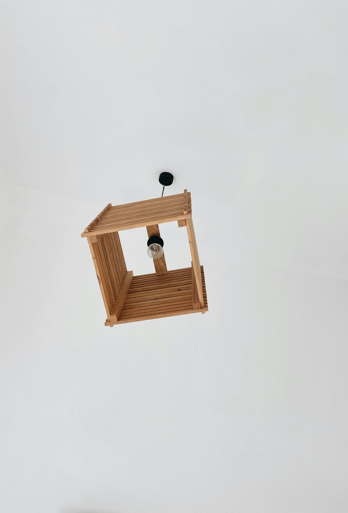 brown wooden chair on white floor