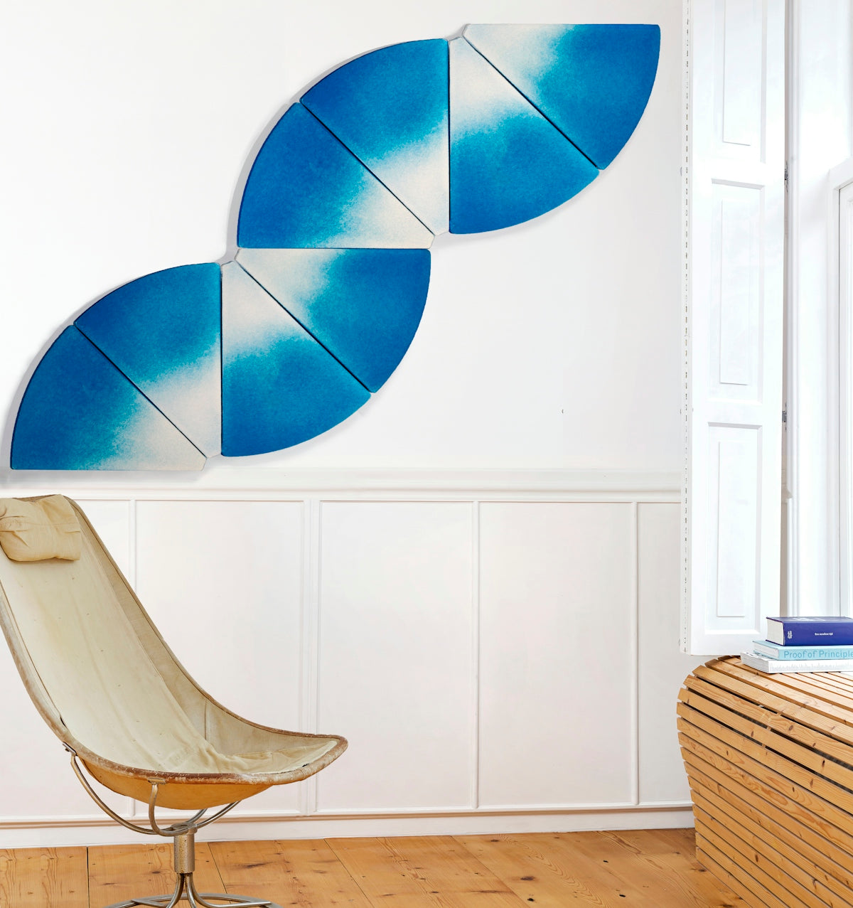 a chair sitting in a room next to a wall