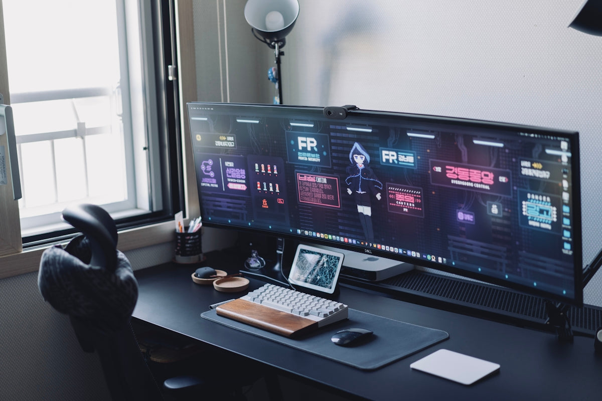 a computer monitor sitting on top of a desk