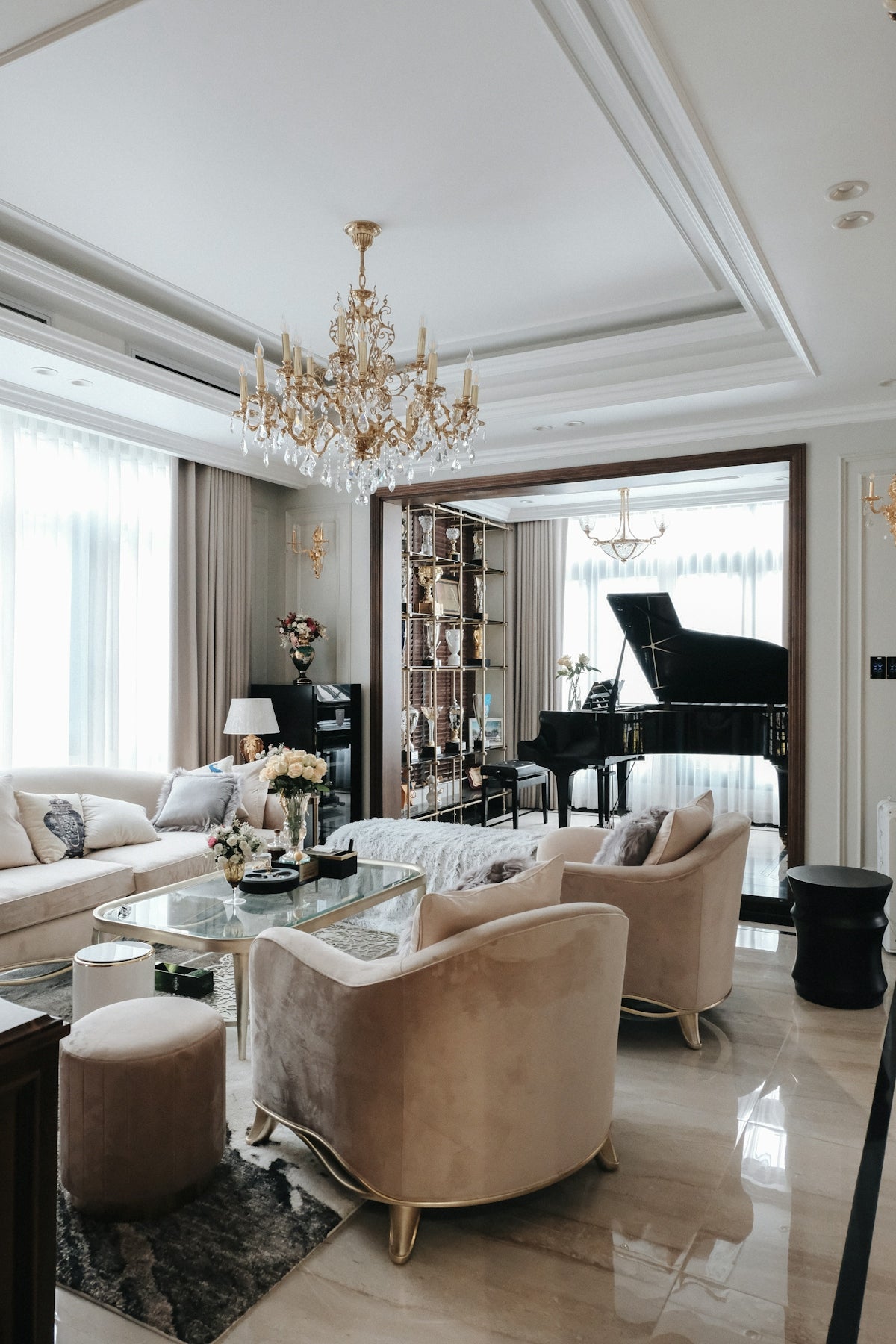 a living room filled with furniture and a piano