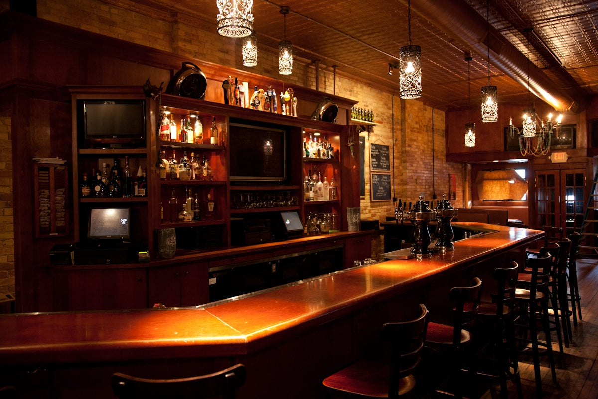 a bar with a bar and chairs