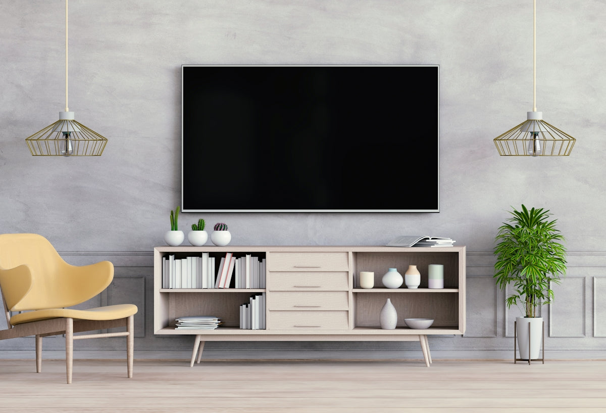 a room with a tv and shelves