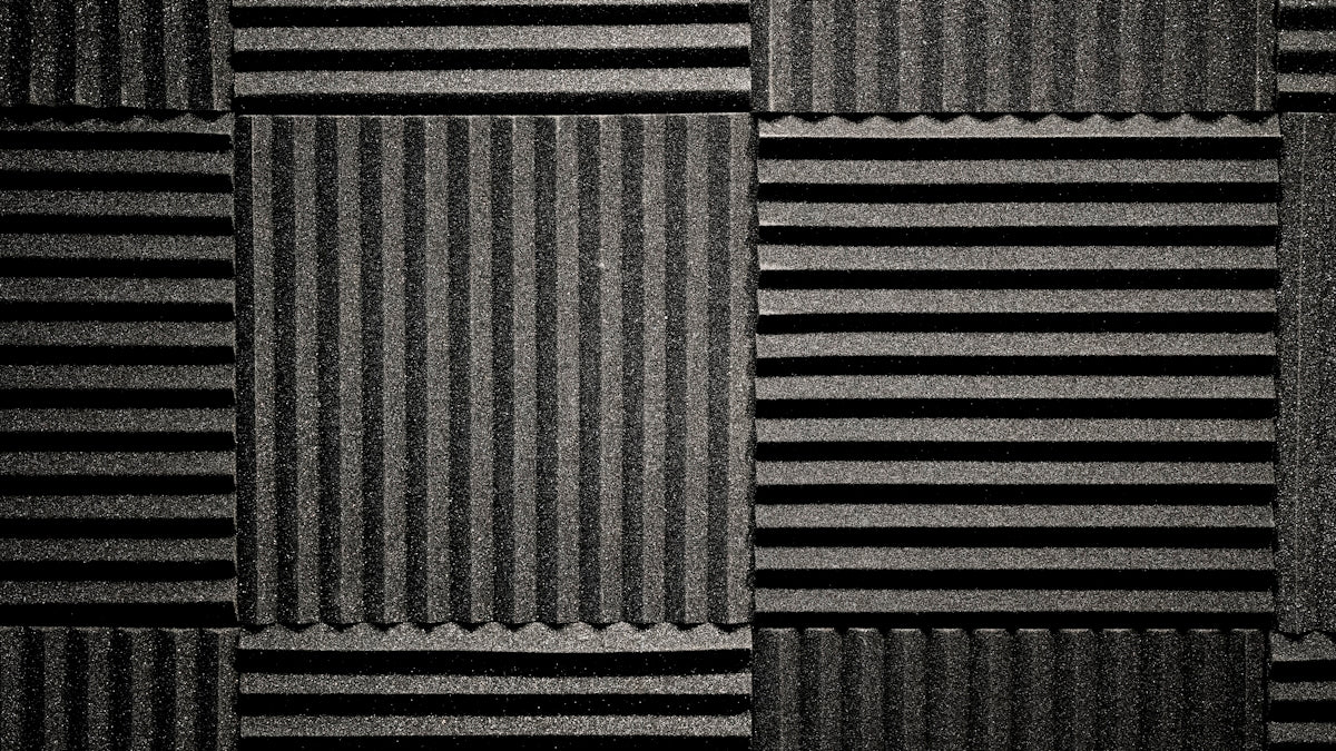 a black and white photo of a wall made of corrugated
