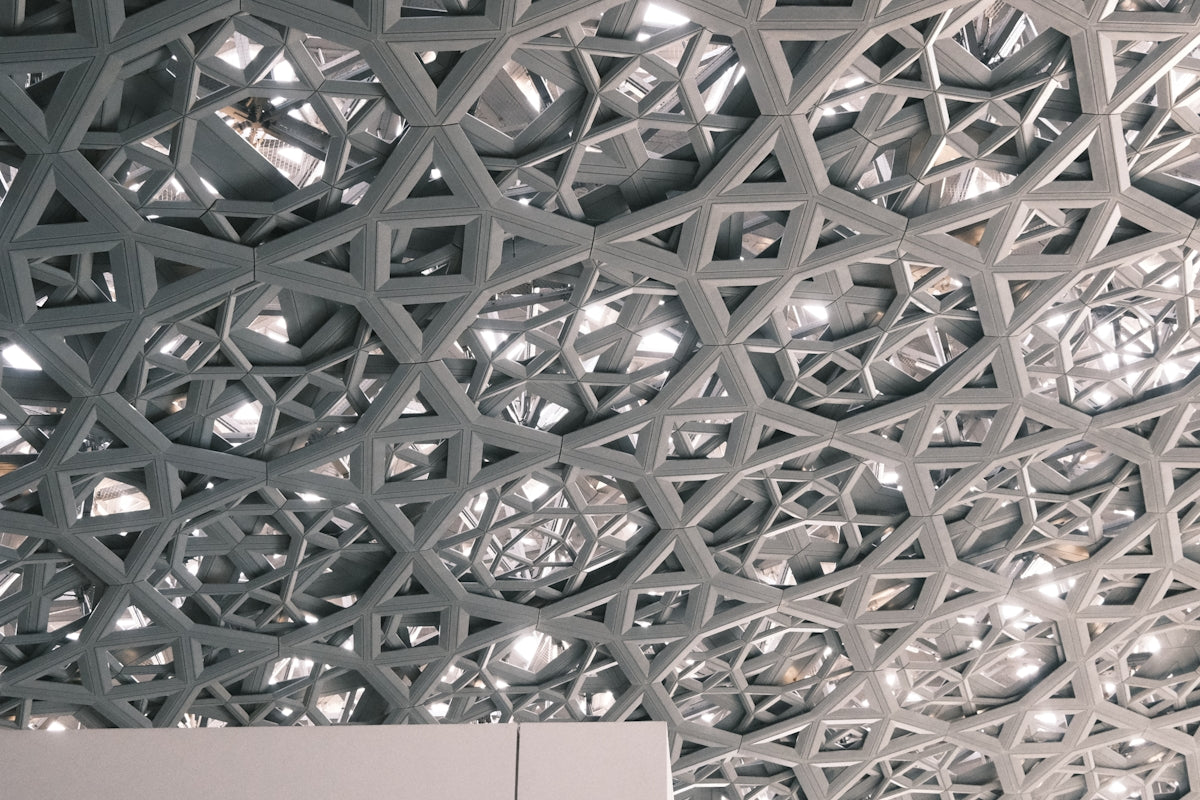 a close up of a building with a pattern on the ceiling