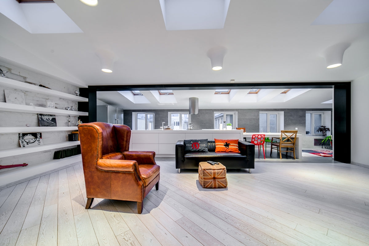 a living room filled with furniture and a fire place