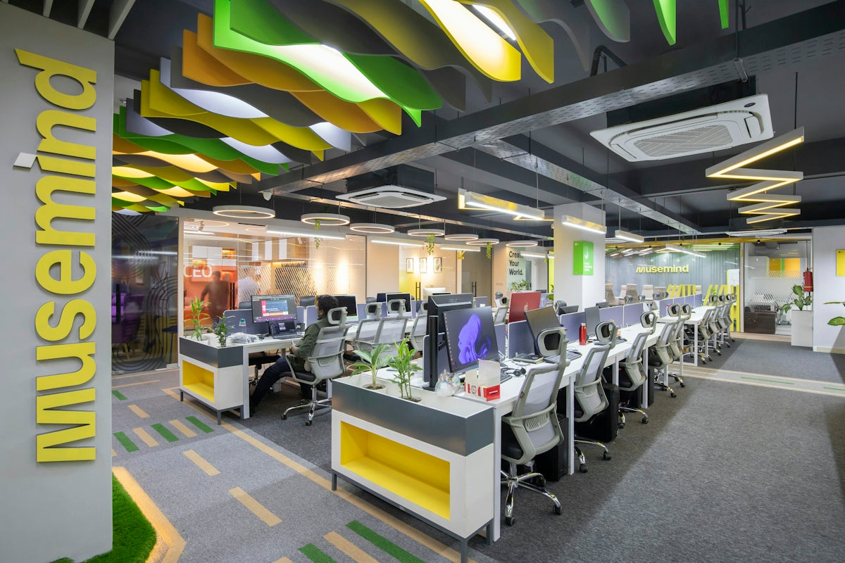 a large open office space with desks and computers