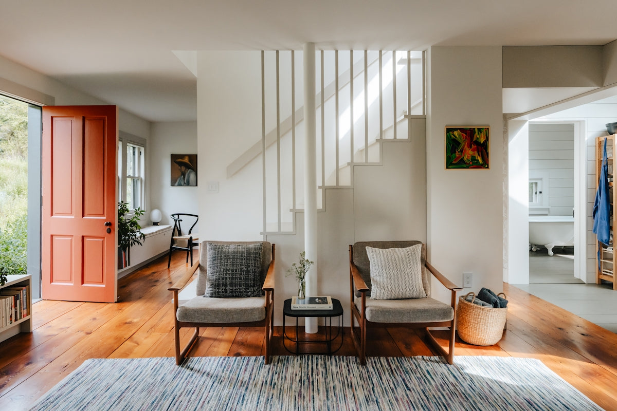 A living room filled with furniture and lots of windows