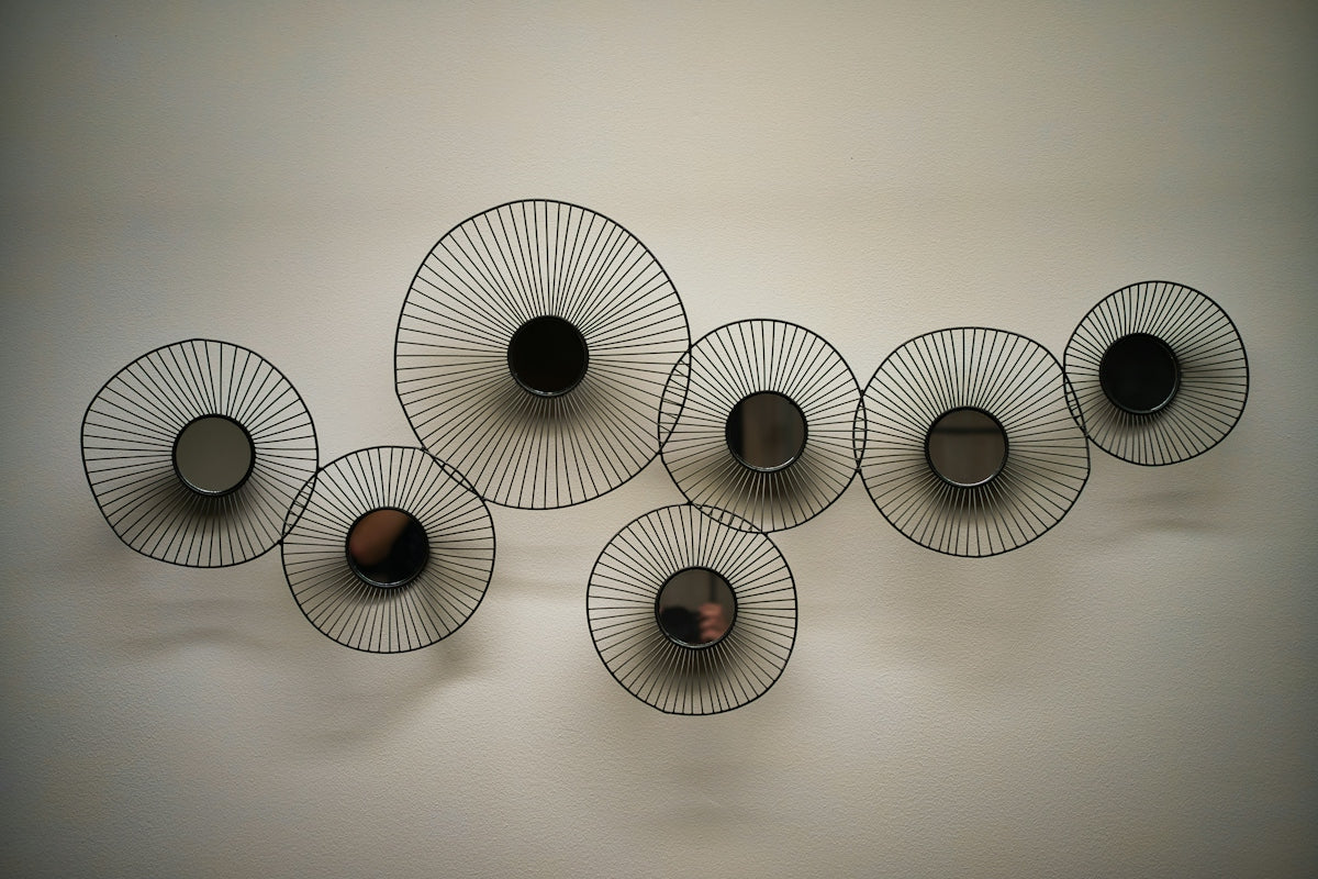 A group of black and white objects hanging on a wall