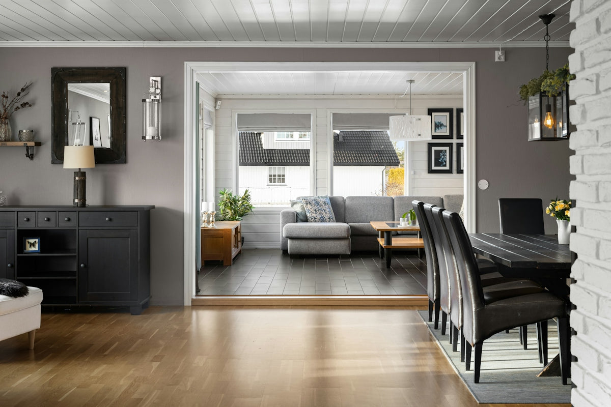 A living room filled with furniture and a wooden floor