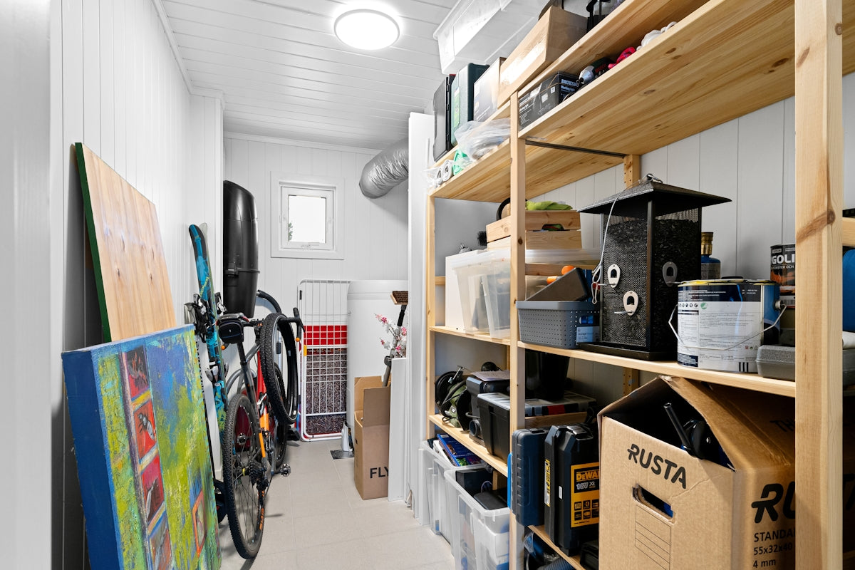 A long narrow room with a lot of storage