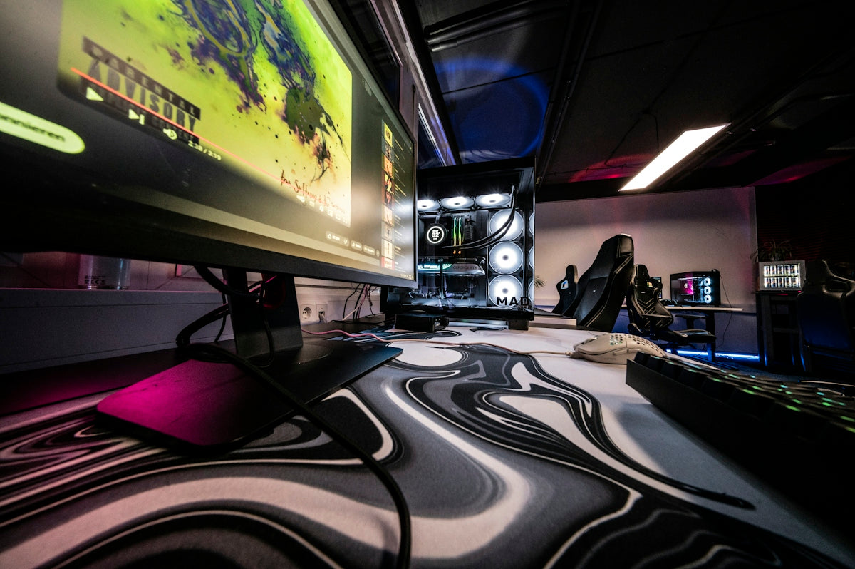 A video game room with a large screen