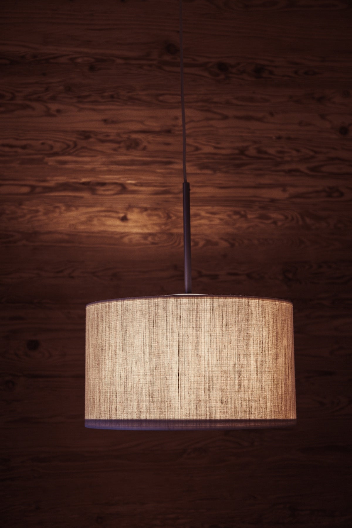 A lamp hanging from a ceiling in a room