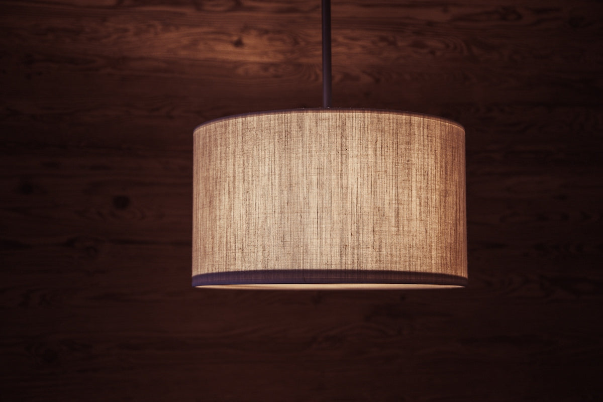 A lamp hanging from a ceiling in a room