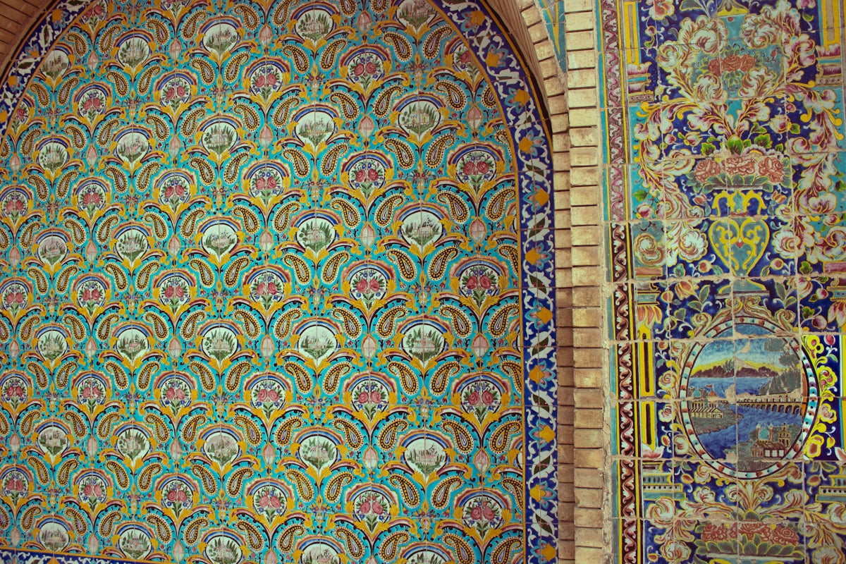 A wall with a colorful design on it