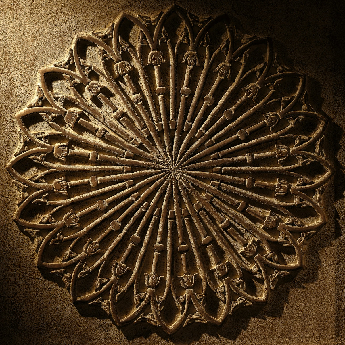 A decorative wall hanging on the side of a building