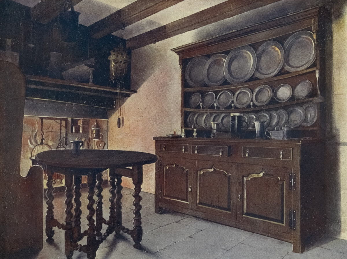 Rustic kitchen with wooden table and plate rack