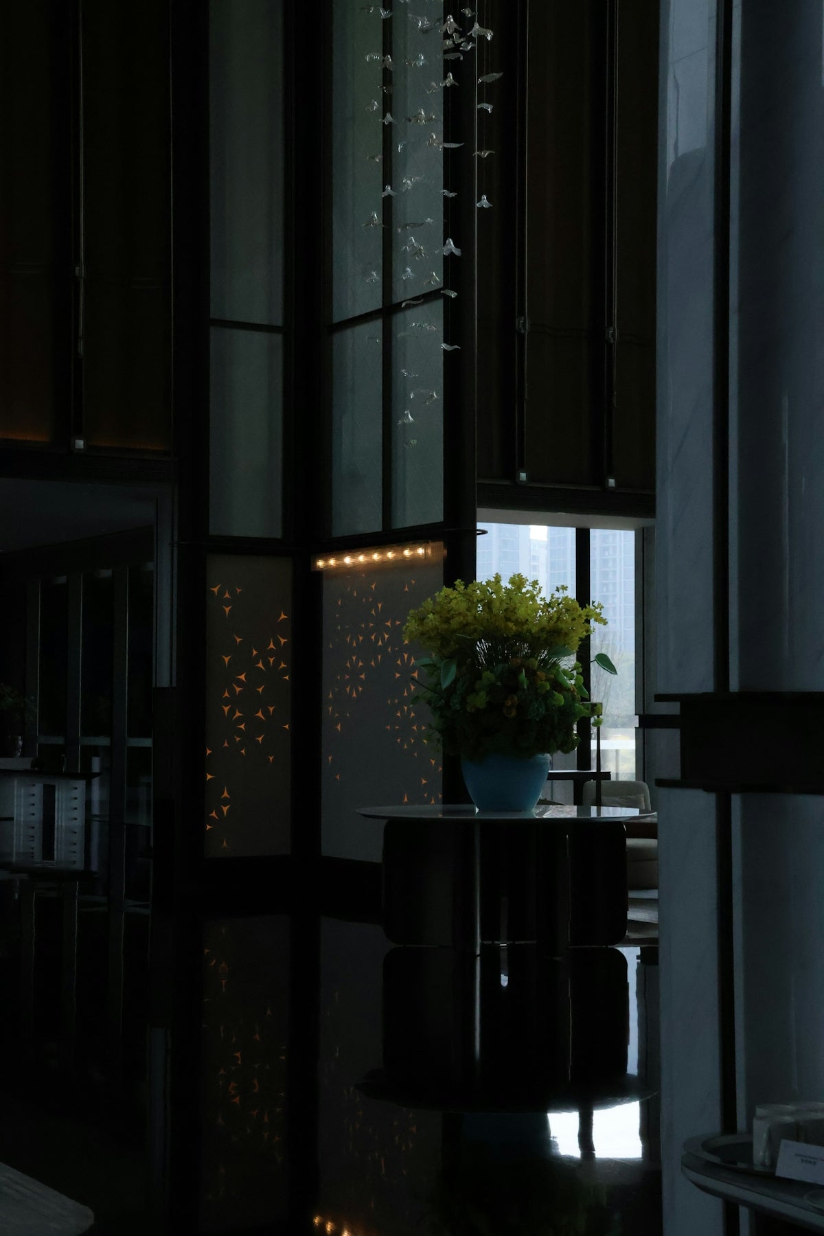 Lobby interior with elegant decor and a floral centerpiece.