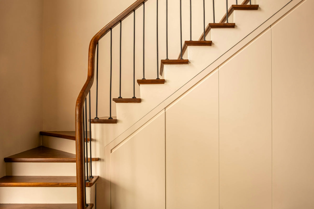 A staircase with wooden steps and a railing.