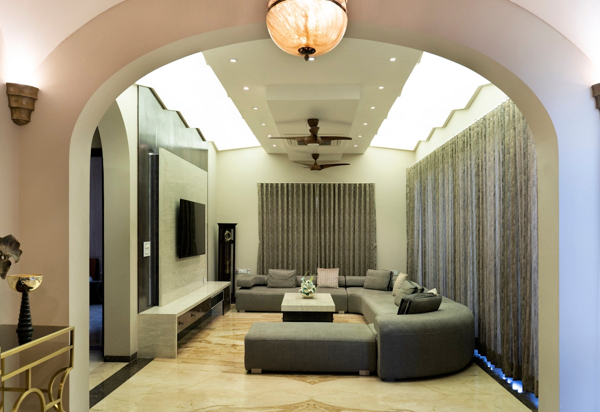 A modern living room with a curved couch.