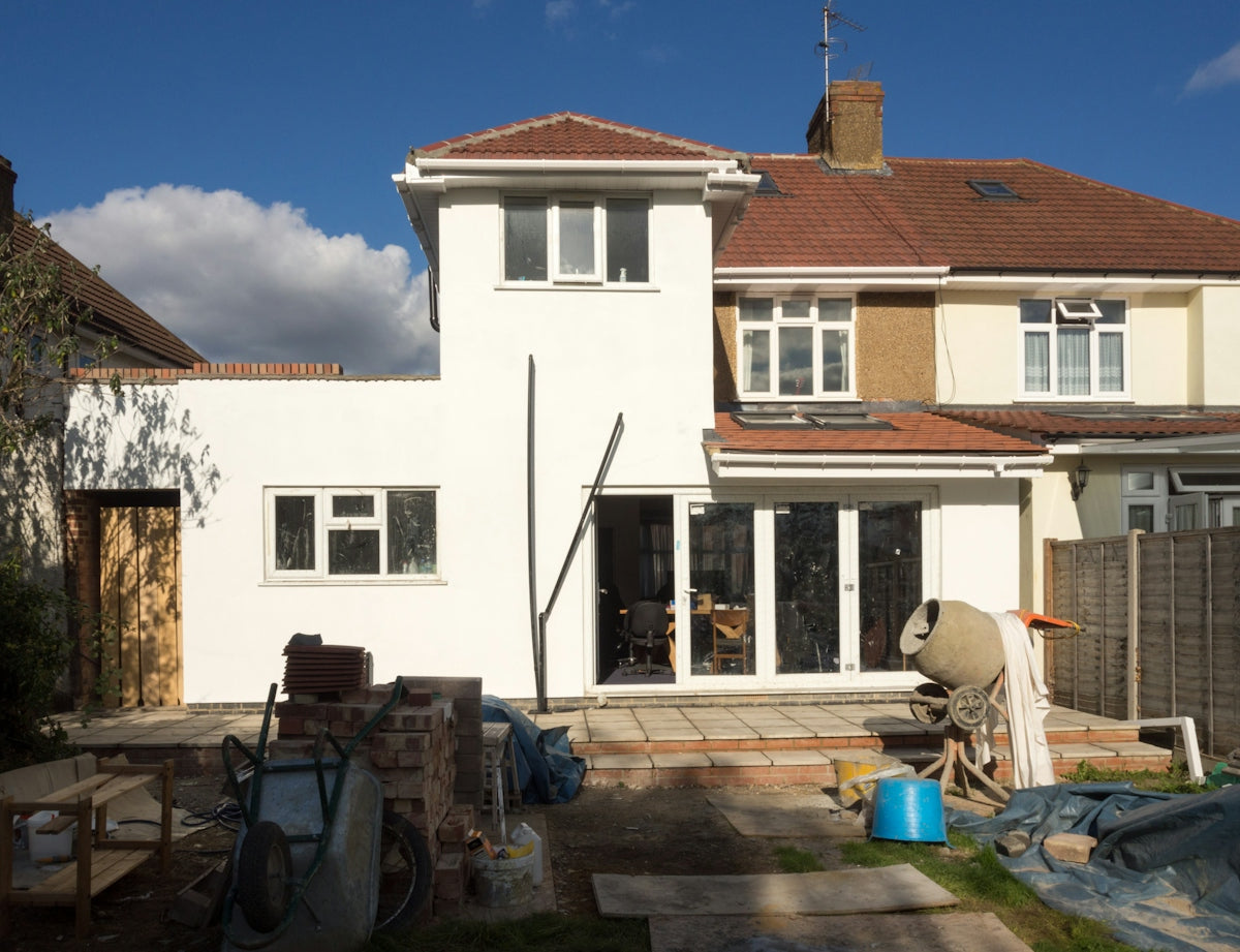 A house undergoing renovation with visible construction.