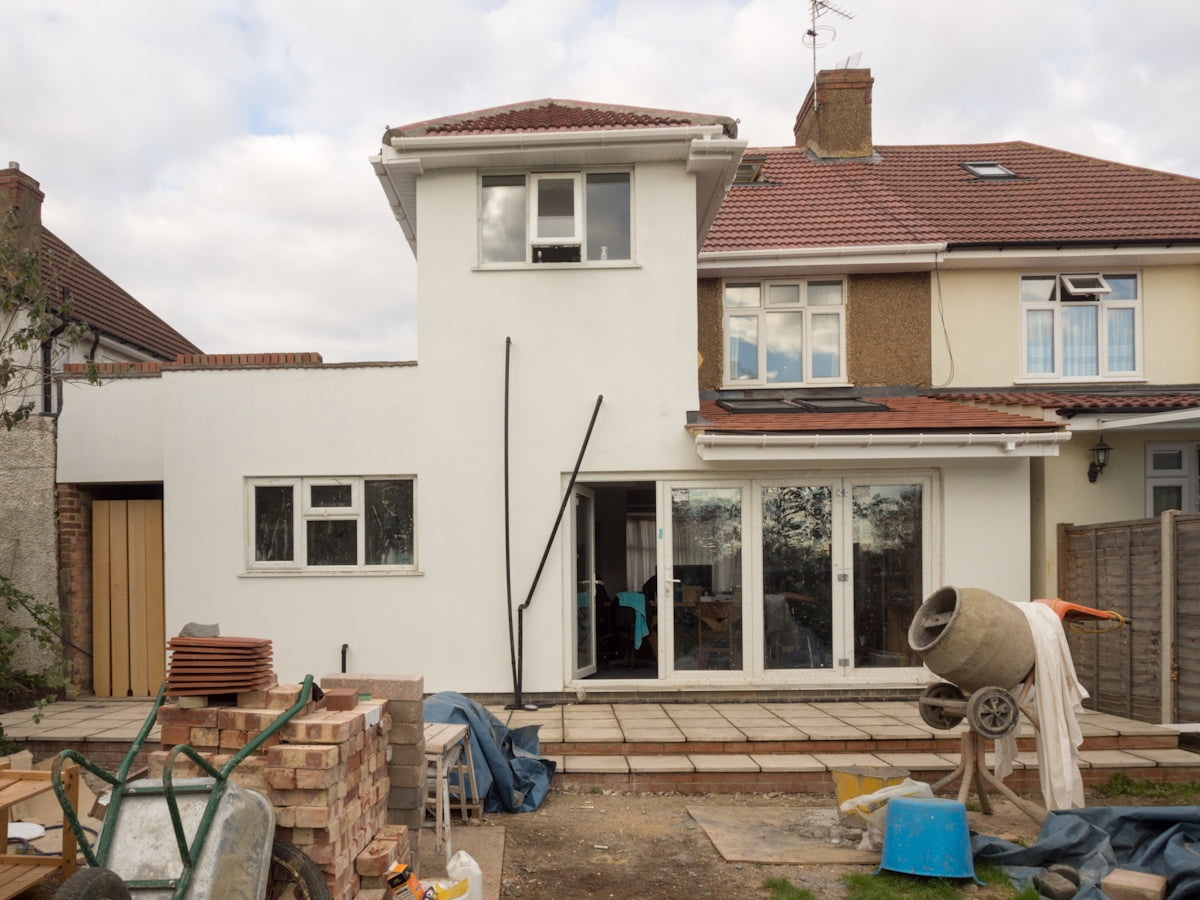 A house under construction is shown.
