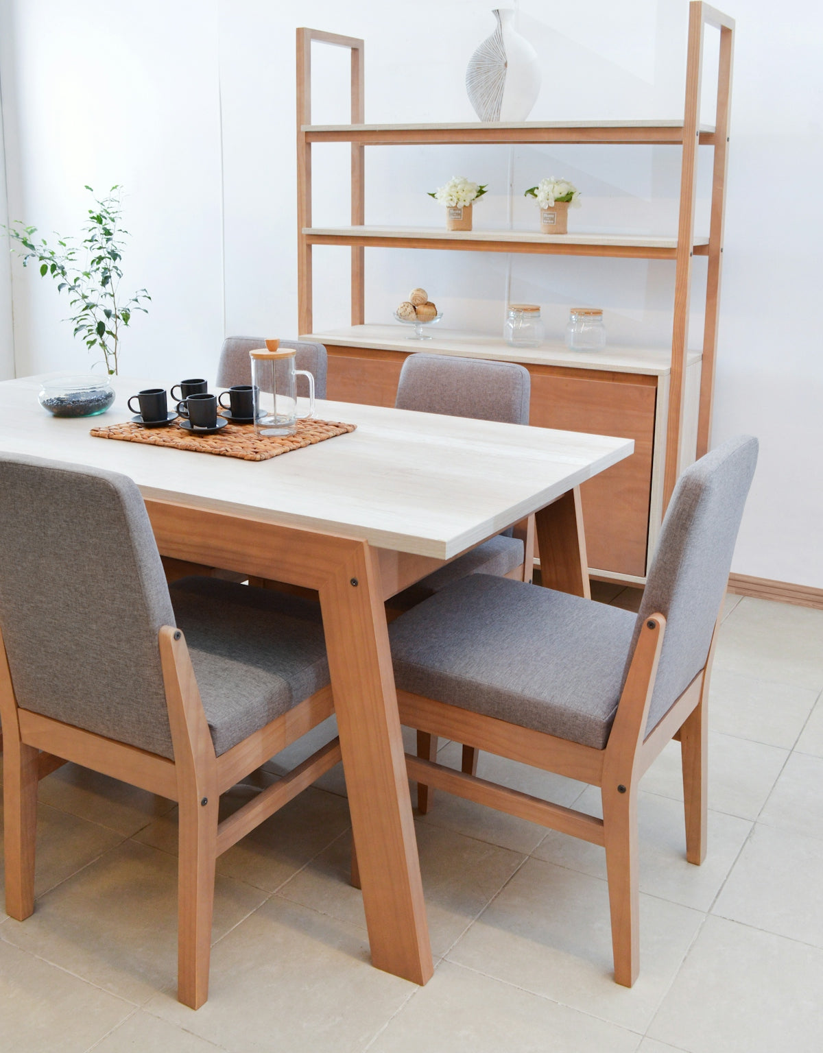 Modern dining room with wooden table and chairs.