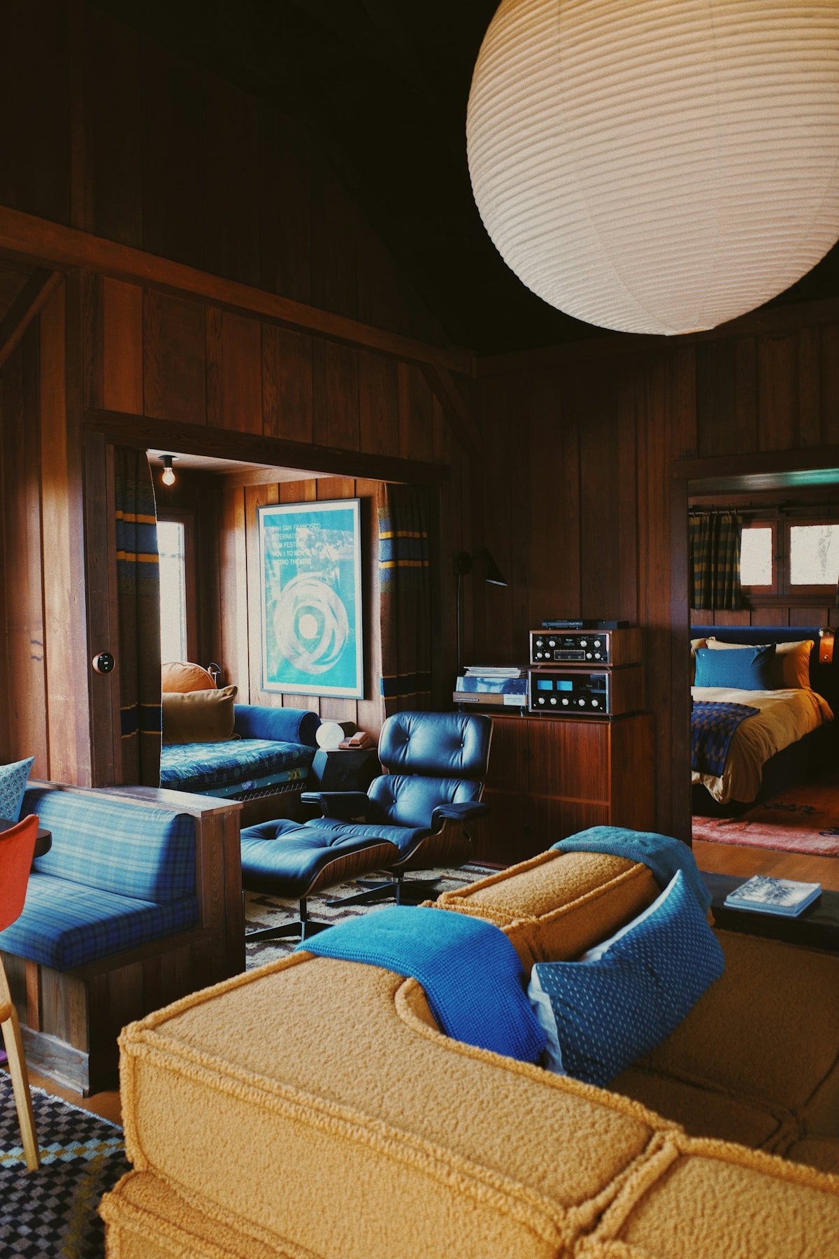 Cozy living room with mid-century modern furniture and decor.