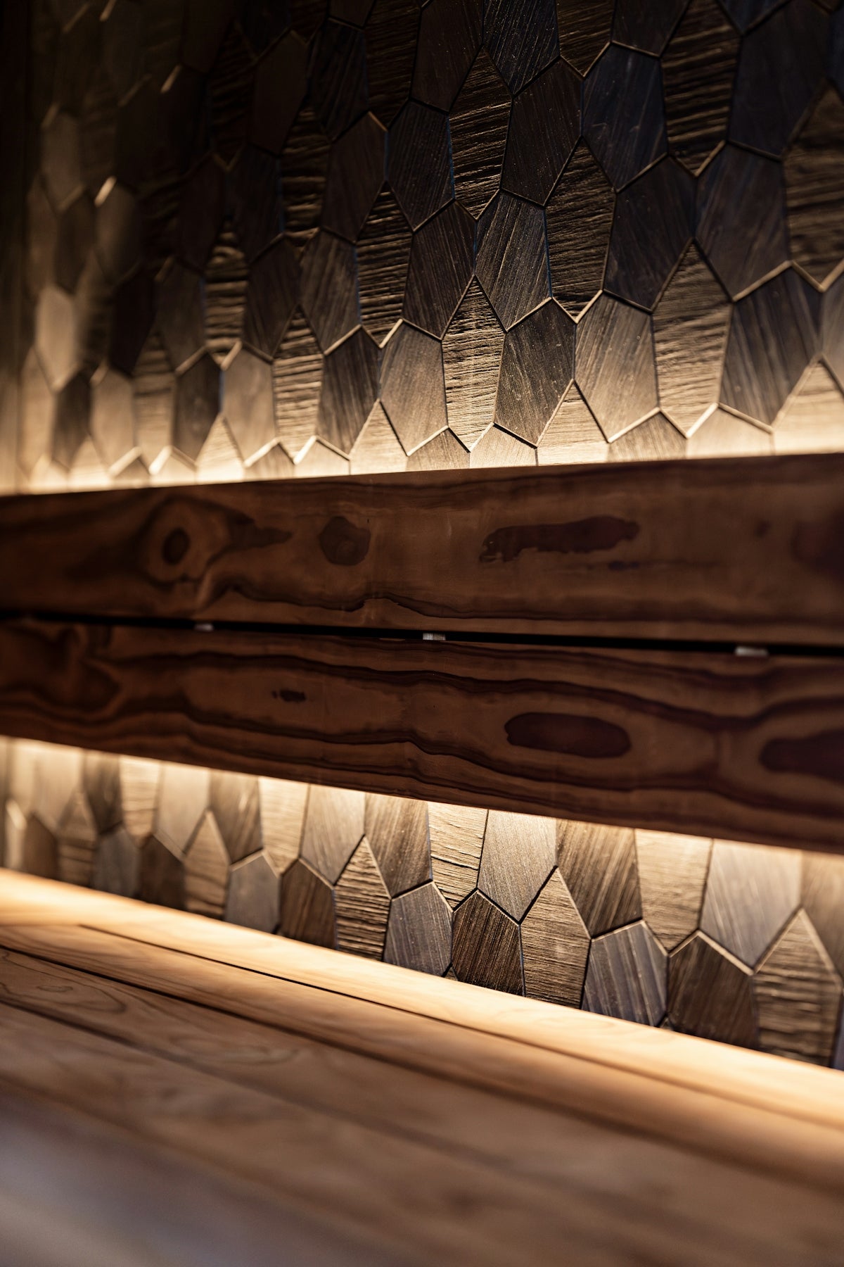 Wooden wall with geometric pattern and warm lighting