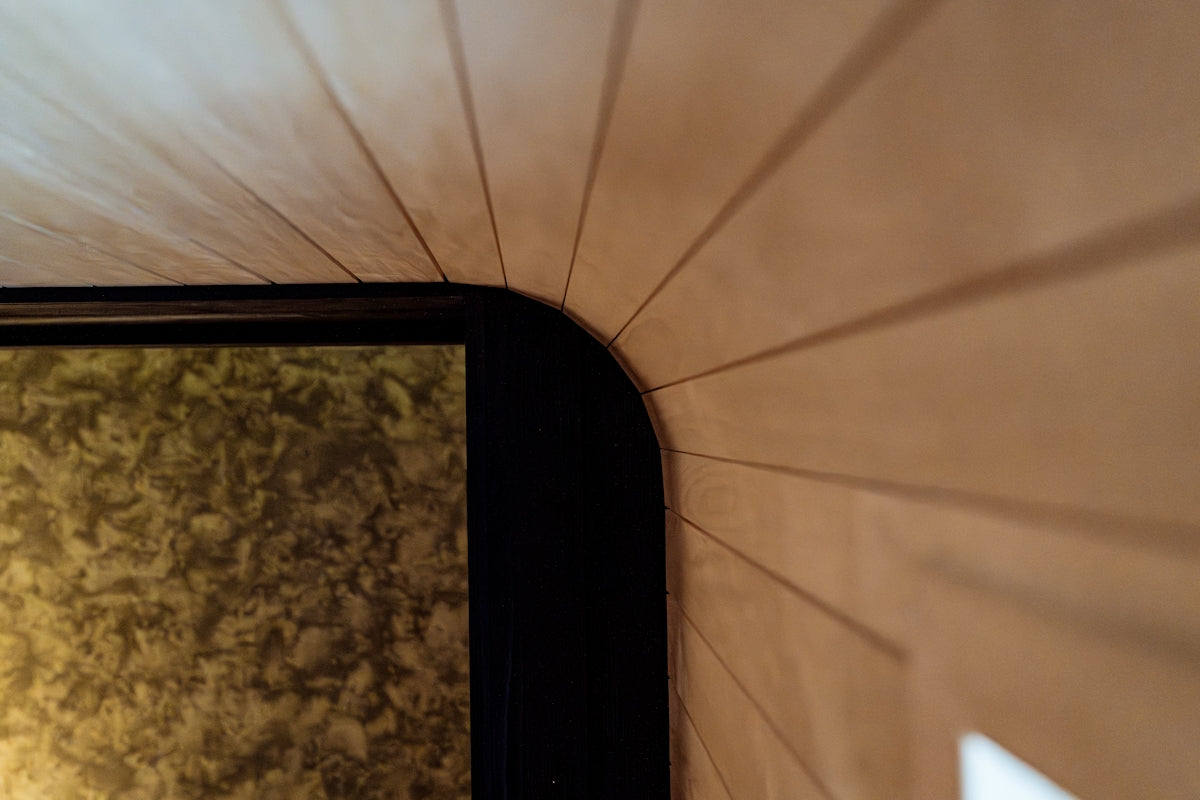 Close-up of a wooden wall with a black frame