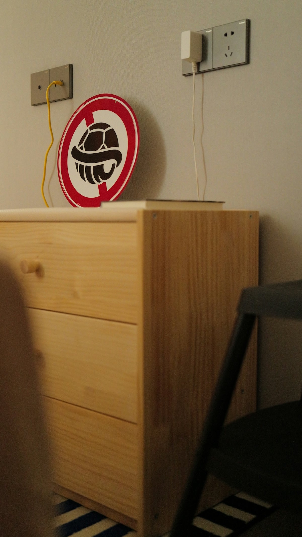 A turtle symbol with a red circle and line