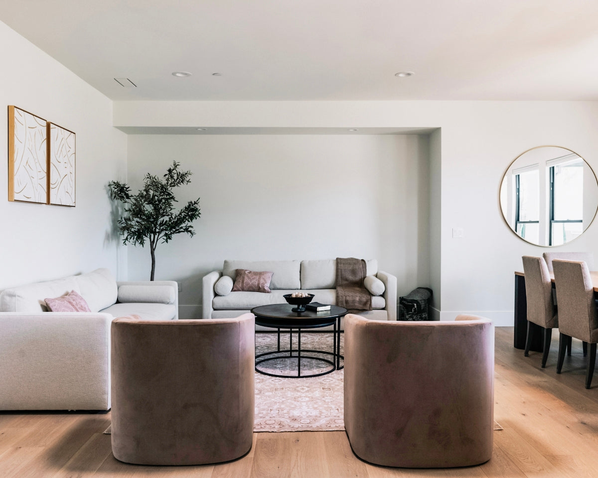 Modern living room with minimalist furniture and decor.