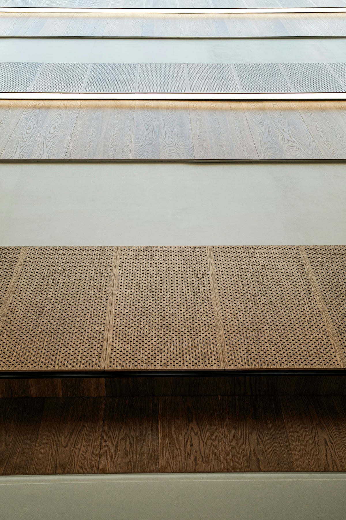 Samples of wood flooring displayed in rows.
