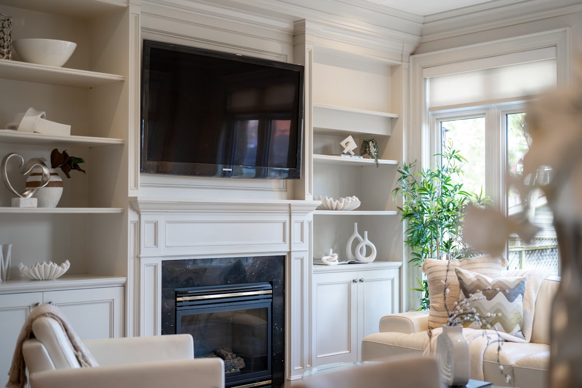 Living room with fireplace and built-in shelves