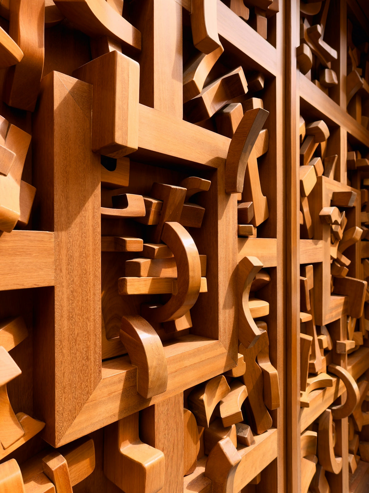 Intricate wooden lattice with abstract shapes