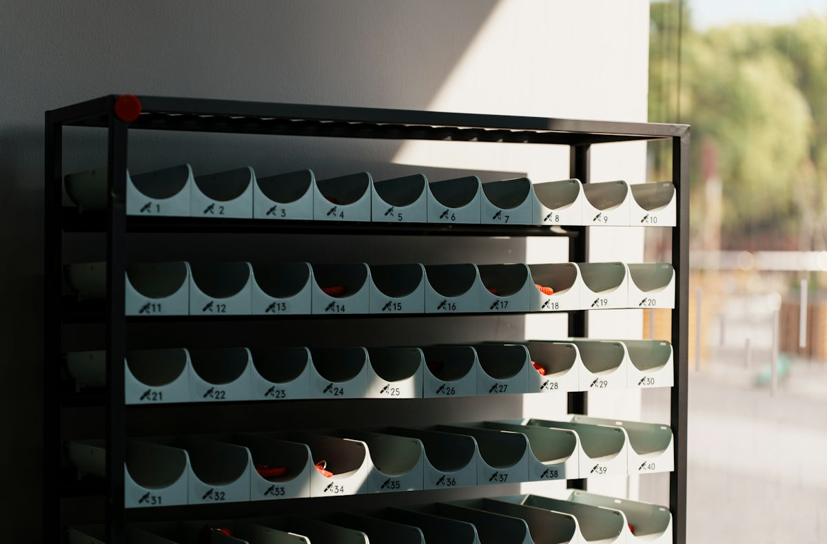 Black metal shelving unit with many compartments