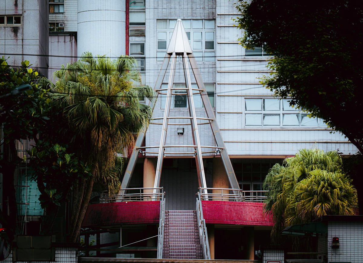 Modern building entrance with geometric pyramid structure