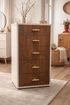 Upgraded multi-drawer makeup vanity storage chest featuring elegant wooden graphic designs in a bright bedroom.