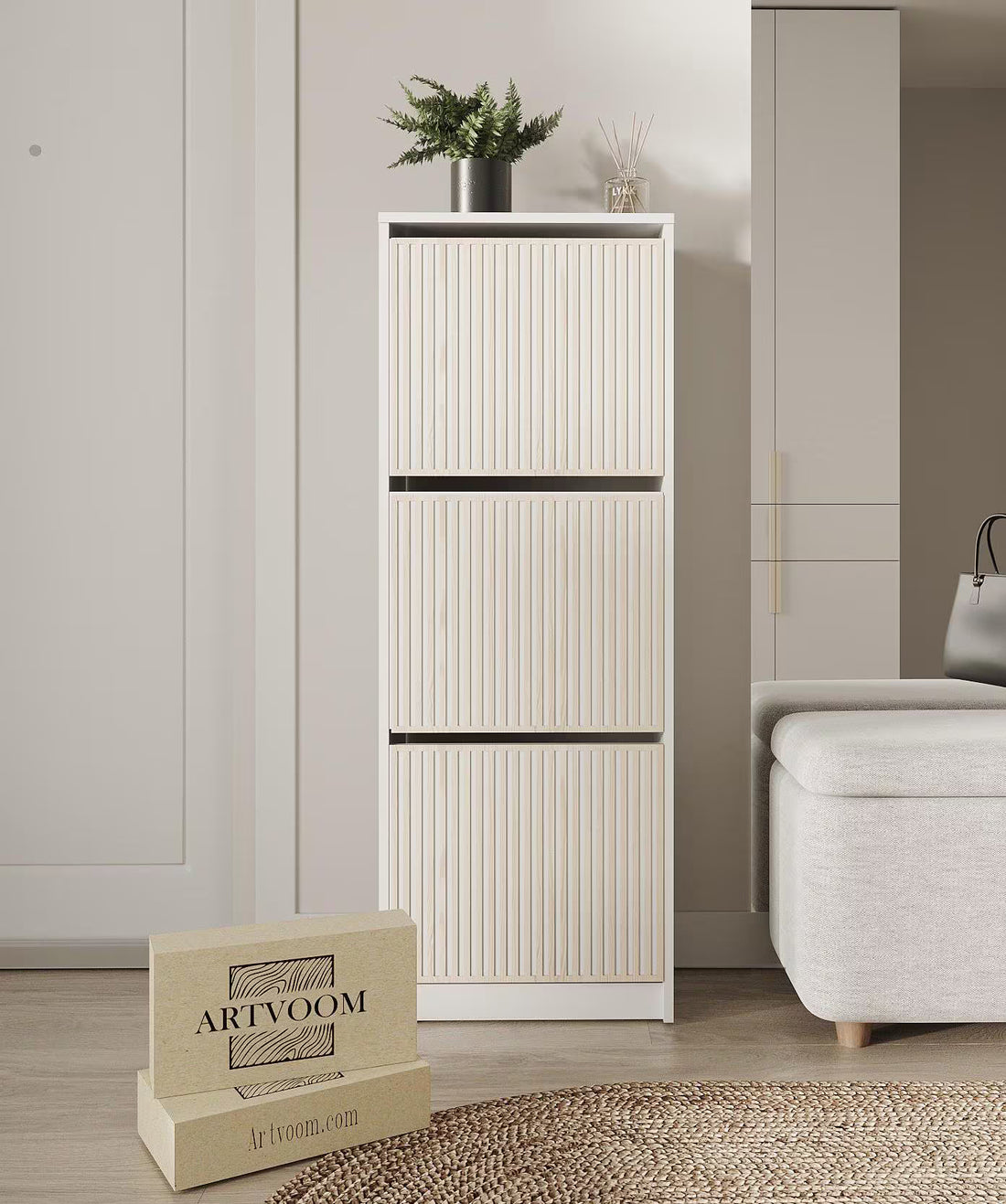 Tall white cabinet with decorative items in a room setting, featuring the brand &