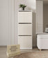 Tall white cabinet with decorative items in a room setting, featuring the brand &