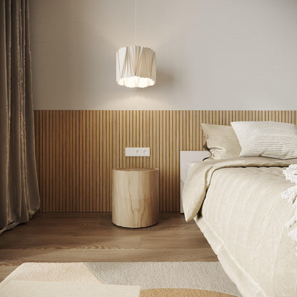Modern interior transformation showcasing large format slatted wood panels as a custom bed headboard.