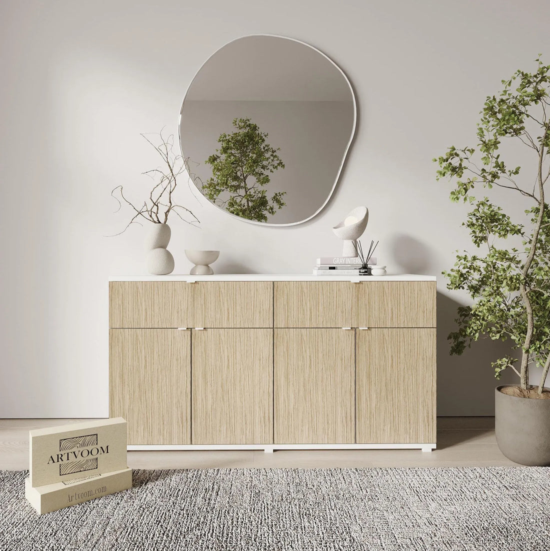 Light wood cabinet with round mirror and decorative items in a room setting.