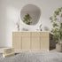 Light wood cabinet with round mirror and decorative items in a room setting.